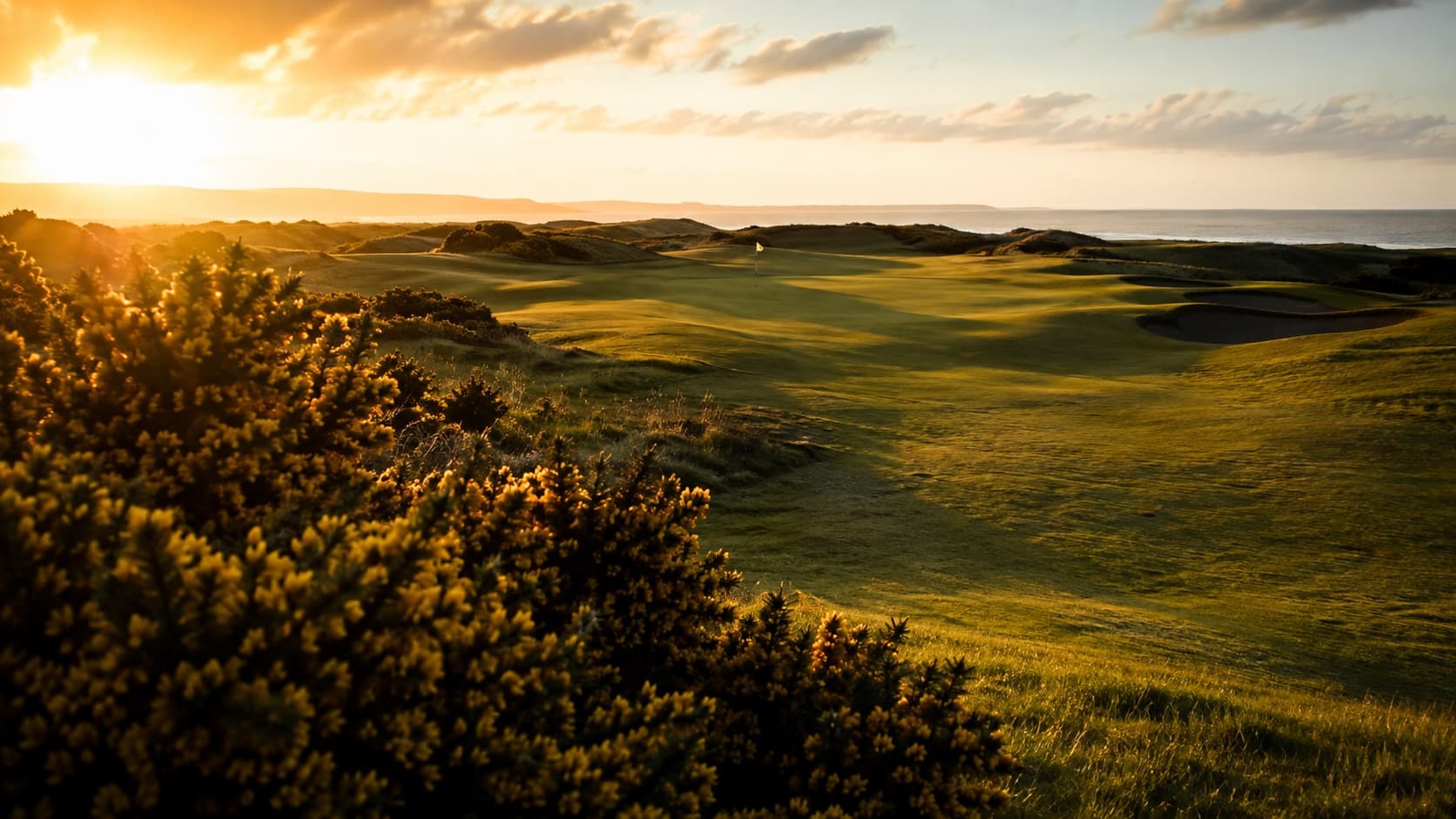 A quiet Ayrshire links golf course with the sea on the horizon
